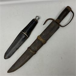  British Private Purchase fighting knife by William Rodgers, Sheffield, the 15cm double edge steel blade with raised medial ridge, stamped on one side of the ricasso WILLIAM RODGERS I CUT MY WAY, the opposing side marked MADE IN SHEFFIELD, ENGLAND, with aluminium crossguard and pommel, stacked leather washers grip and leather scabbard L27.5cm overall; and a crudely made short sword with 32.5cm single edged blade and steel knucklebow hilt with hardwood grip; in cane bound wooden scabbard L45cm overall (2)