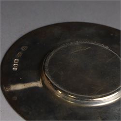 Mid 20th century silver travelling communion set, comprising goblet, paten and pyx, all hallmarked Hurst, Franklin & Co Ltd, London 1961 & 1962, with a glass bottle with unmarked cover, all within a tooled leather fitted case, goblet H9cm