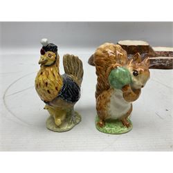 Seven Beswick Beatrix Potter figures, comprising Sally Henny Penny, Johnny Town-Mouse, Mrs Tiggy-Winkle, Mrs Tittlemouse, Tom Kitten, Pig-Wig and Squirrel Nutkin, together with a Beswick tree trunk display stand, stand L30cm