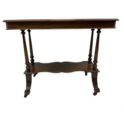 Late Victorian mahogany Aesthetic movement side table, moulded rectangular top with rounded corners, turned pillar supports on undertier, on splayed feet with brass and ceramic castors