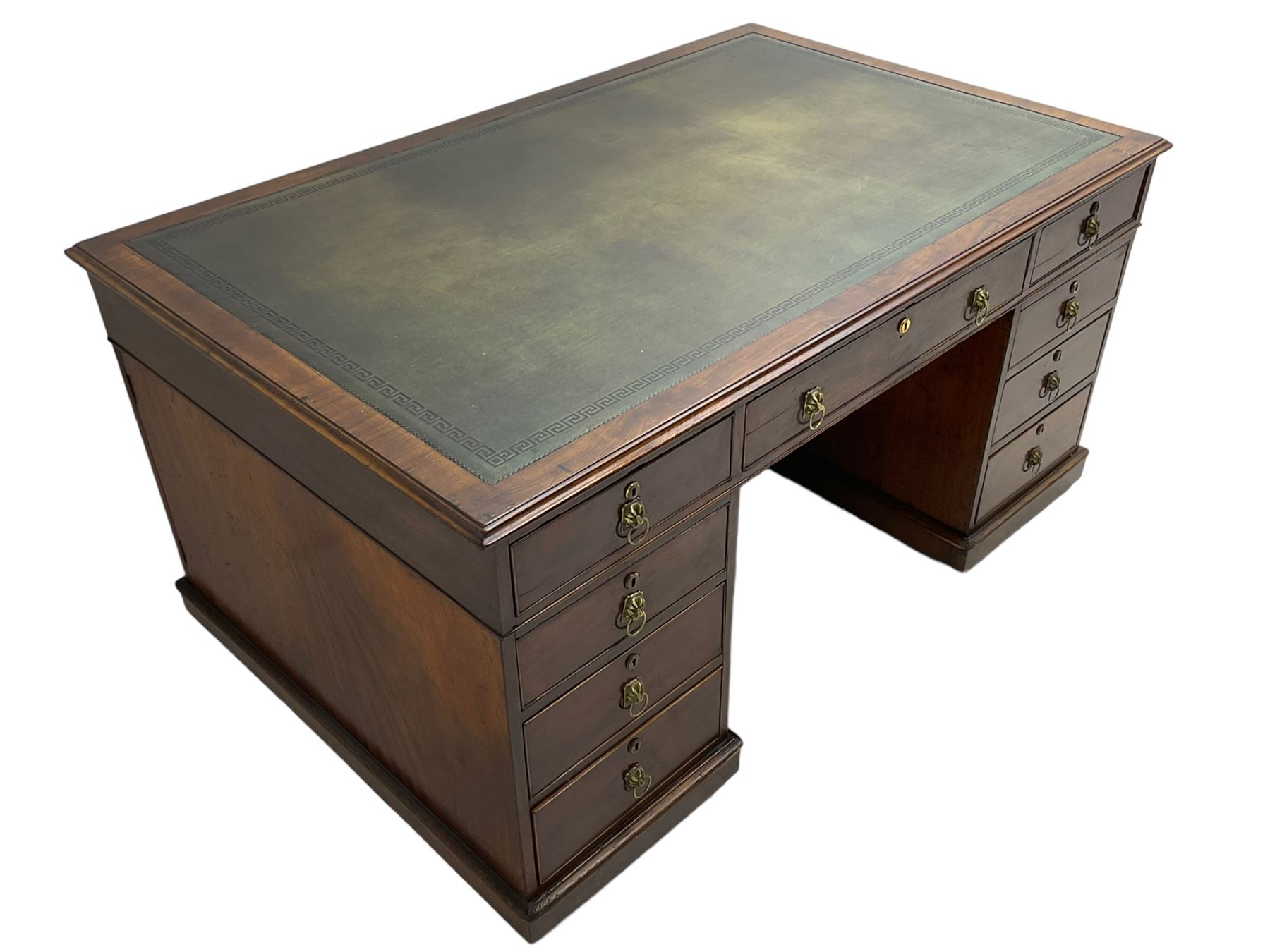 George III mahogany twin pedestal partners desk, rectangular top with moulded edge and an inset green tooled leather writing surface with Greek key design border, fitted with three cock-beaded frieze drawers to each side, each pedestal with three graduating drawers with an opposing panelled cupboard enclosing a single shelf, the facias fitted with brass lion mask plates with ring handles, the lower moulded edge over a plinth base and castors, London furniture dealers label to interior of drawer inscribed 'J. Webb, Office Furniture 323, Gray's Inn Road, King's Cross'  H75cm  W153cm  D97cm