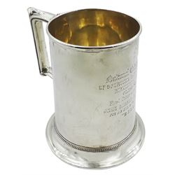 Victorian silver tankard of slightly tapering cylindrical form with engraved dedication to body, and angular scroll handle, upon a flared foot with beaded border, hallmarked Birmingham 1868, H14cm, approximate weight 13.76 ozt (428.2 grams)
