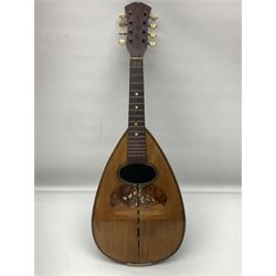 Late 19th century Italian lute back mandolin with segmented bowl back, bears label Gennaro Maglioni Napoli L61cm; in ebonised wooden case; together with another similar damaged Italian lute back mandolin for restoration or spares (2)