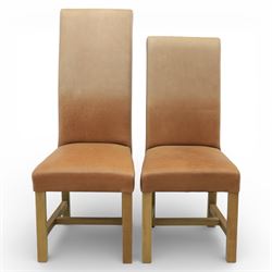 Modern large oak plank top dining table and twelve brown leather high back chairs, table of rustic construction five solid planks with exposed supports, the chairs in brown leather hide with ten standard height and a pair of taller chairs for the foot and head of the table