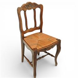 20th century French oak drawer-leaf extending dining table and six chairs, the rectangular parquetry top with moulded edge and rounded corners, pull-out draw leaves extending the table to 240cm, carved frieze with foliate detail, raised on cabriole supports with scroll terminals, the six matching chairs with shaped backs carved with floral motifs, paper cord seats woven with a green pattern, cabriole front supports and turned stretchers