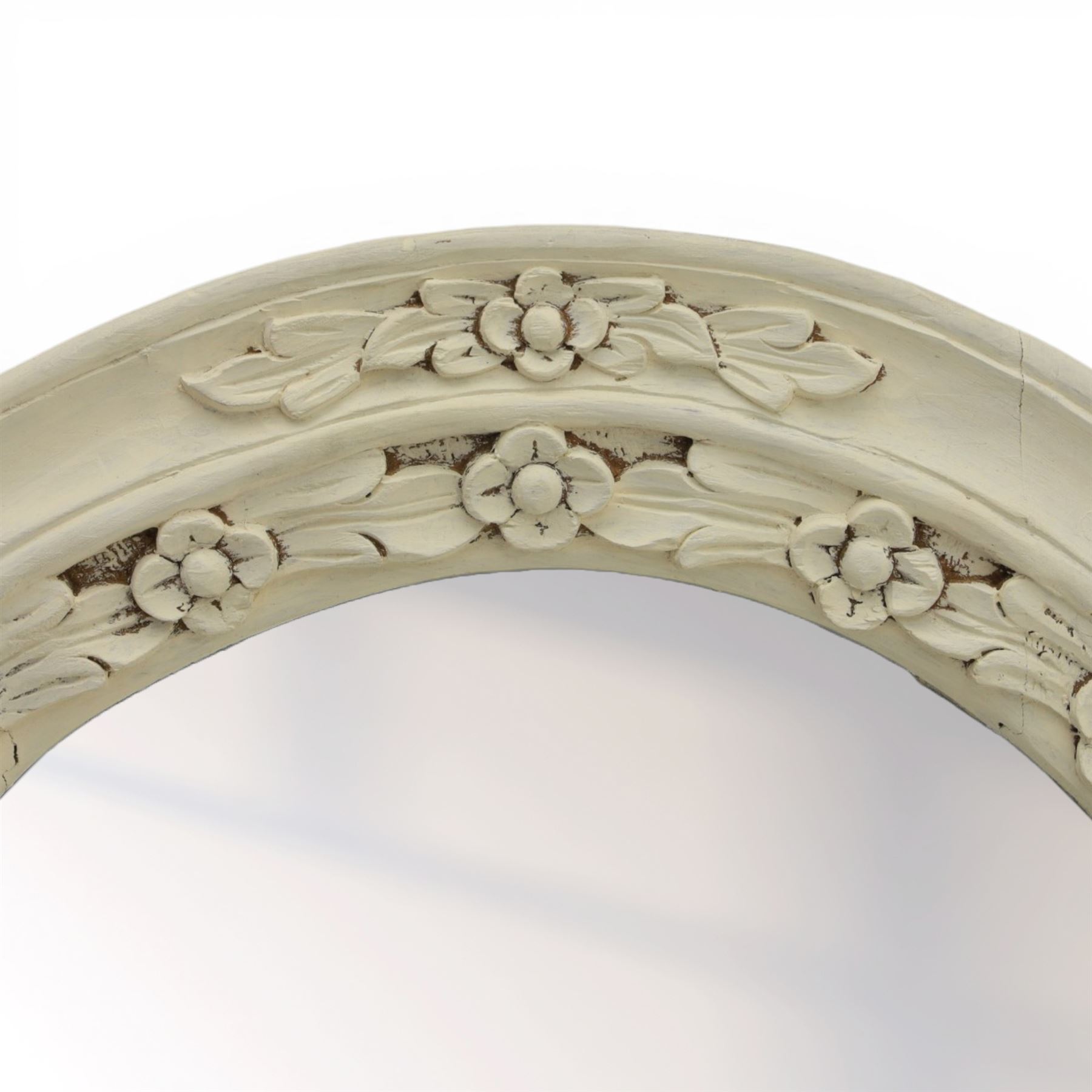 Oval painted pine wall mirror, with carved stepped edge, with mounts for hanging