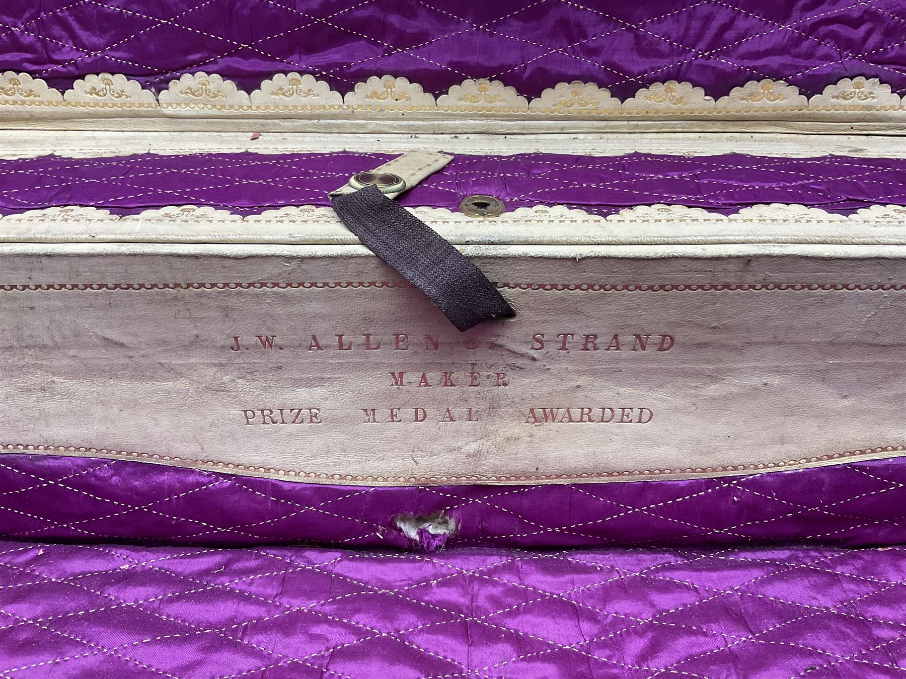 19th century leather suitcase, with brass plaque to cover engraved 'C R F Lutwidge Esq', the pink silk and white kid leather interior with pouch and edging impressed with gilt lettering reading 'By Appointment of Prince of Wales J W Allen 37 Strand Maker Prize Medal Awarded', H21cm, W73cm, Notes: Charles R. Fletcher Lutwidge, was mayor of Tunbridge Wells between 1895-1898, and again between 1901-1902