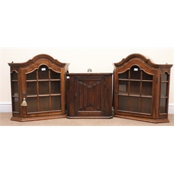  Two Dutch oak wall display cabinets, glazed doors enclosing two shelves (W66cm, H69cm, D17cm) and a small corner cupboard (3)  