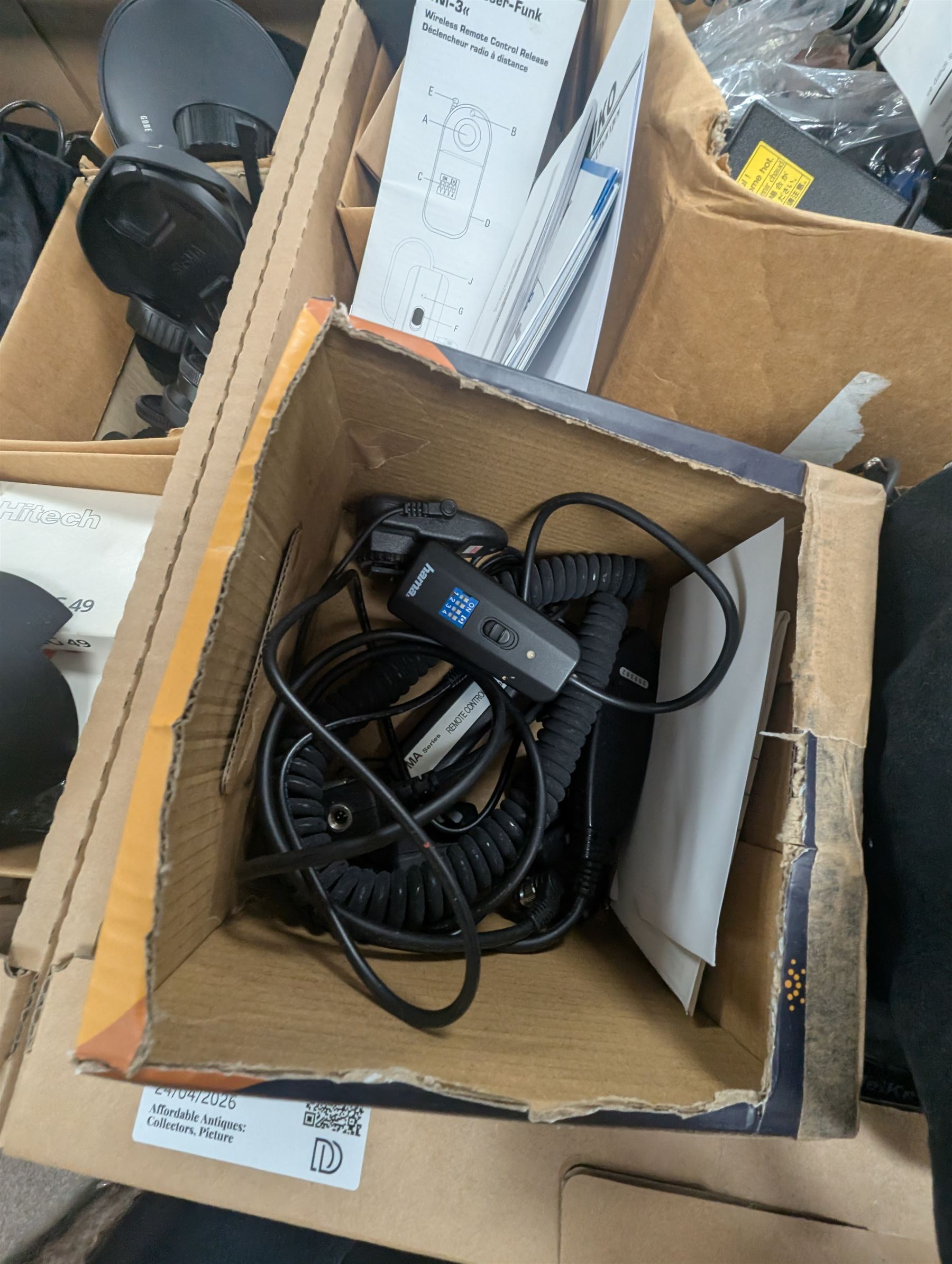 Collection of photography equipment, including flashes, hoods, filters, telephoto lens, bags, etc