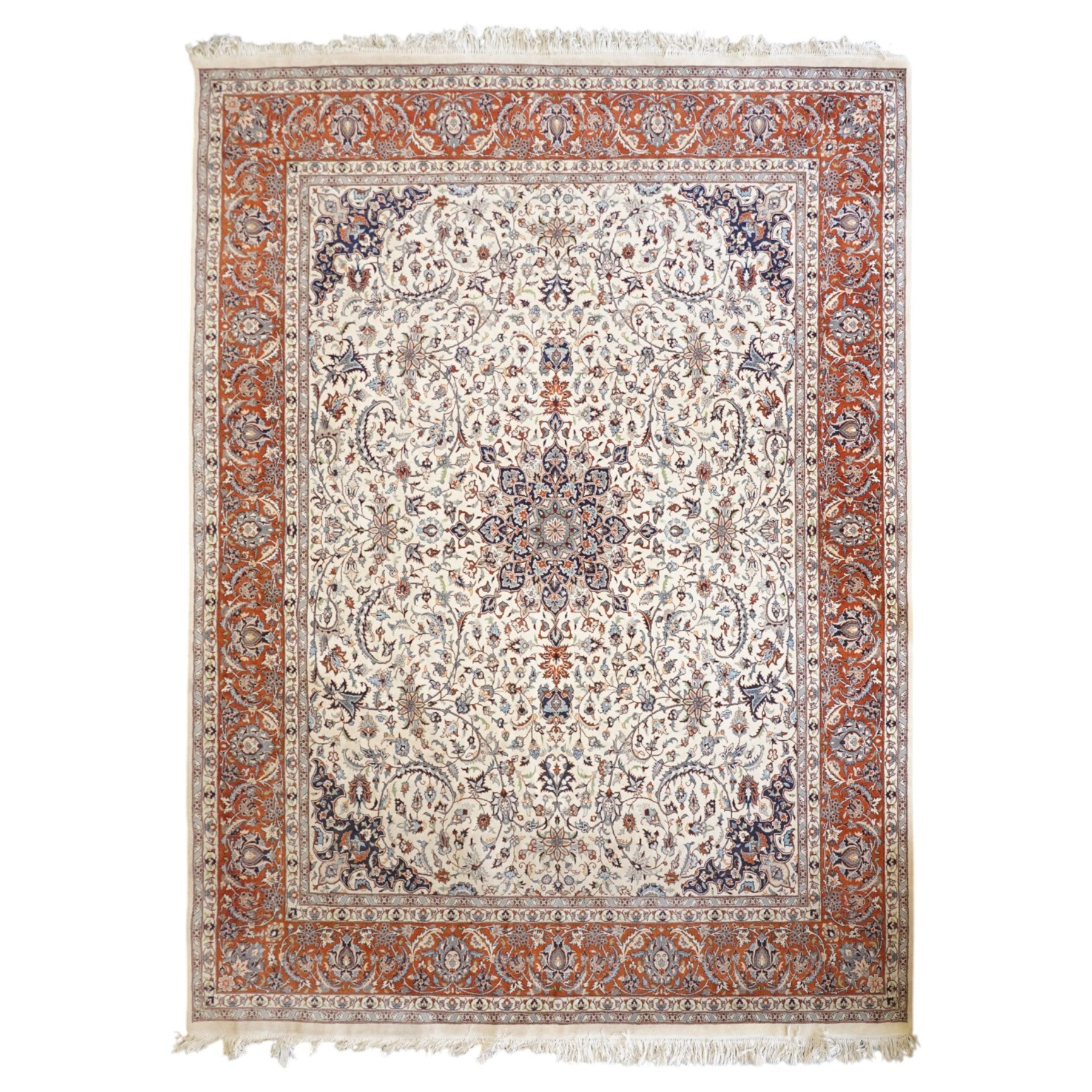 Persian ivory ground Kashan carpet, the busy field decorated with a central floral pole medallion with matching spandrels, the field profusely decorated with scrolling foliate motifs, the crimson guard stripe with repeating scrolling palmettes