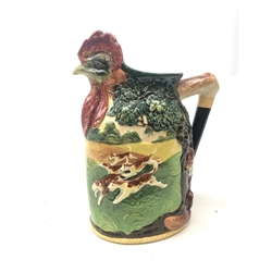  A limited edition Royal Doulton loving cup Master of the Fox Hounds M.F.H. presentation jug, the rim modelled as the head of a cockrell, the body with raised decoration depicting hounds in chase, no 325/500, with printed marks to base, (a/f), H33cm.   