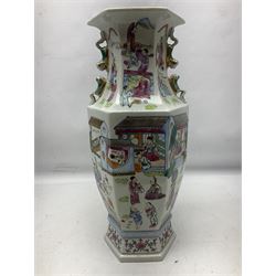 Pair 20th century chinese vases, of hexagonal baluster form,  with applied twin temple lion handles to the waisted neck , the body decorated with village scenes, with a blossoming foliage boarder to the base, H43cm  
