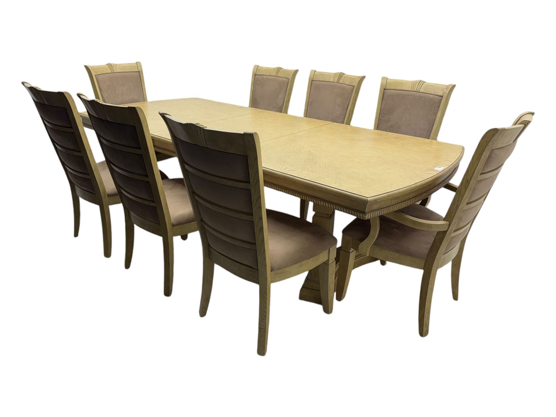 Brunswick - washed oak finish extending dining table, rectangular top with curved ends and carved frieze, central extension leaf, raised on twin pedestals with arched plinth bases and square-sectioned column supports; set of eight (6+2) high-back dining chairs upholstered in beige velvet fabric