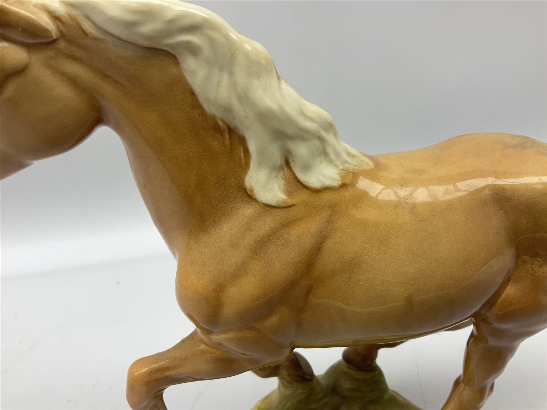 Beswick figure of cantering Palomino horse on base model no 1374, with impressed and printed mark beneath, H18cm