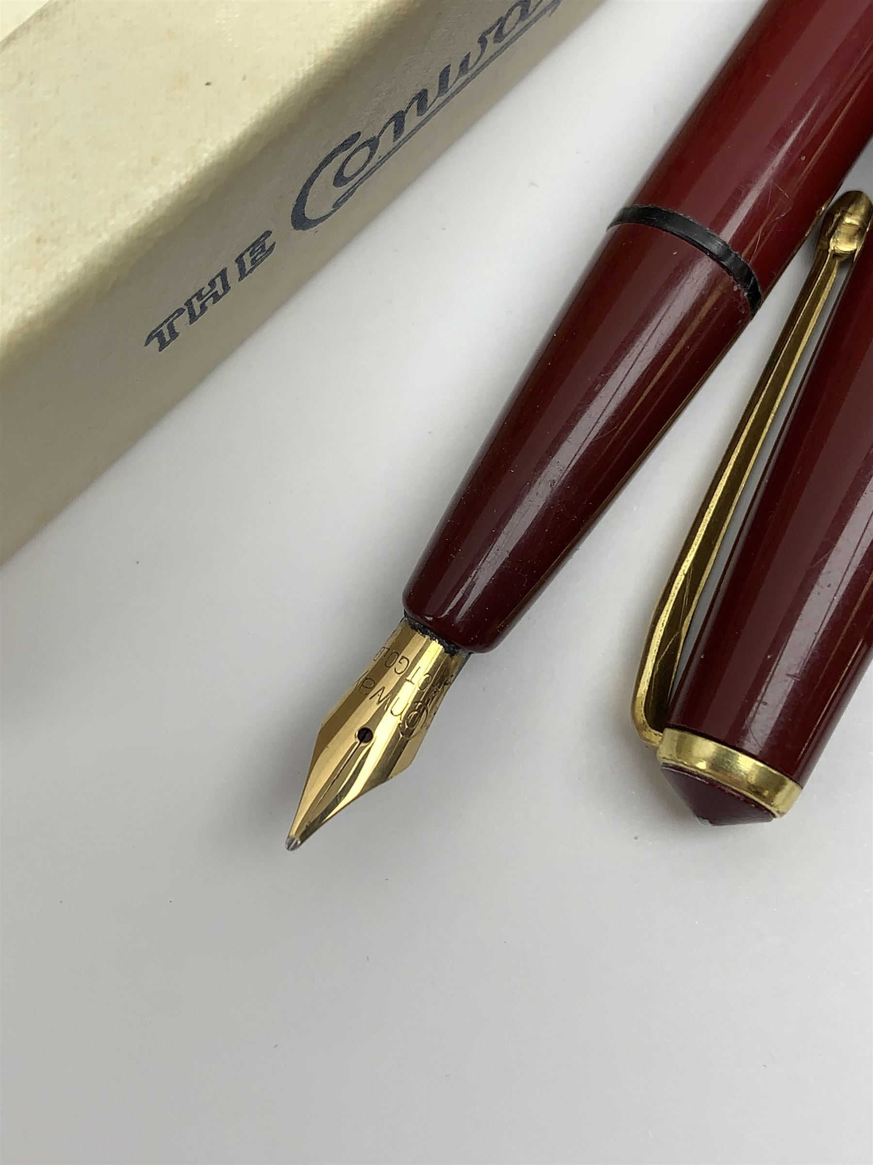 A group of four fountain pens, comprising Parker Duofold, nib marked 14K, Swan Mabbie Todd & Co Ltd Self Filler, nib marked 14C 585, Conway 57, nib marked 14ct, and Waterman Laureat. 