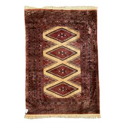 Persian rug, the interconnecting field decorated with four lozenge medallions, multiple band border with overall geometric design decorated with stylised flower head motifs