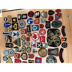  Collection of military cloth badges including Commando, Parachute, naval, USA, German etc, approx. one-hundred and fifty  