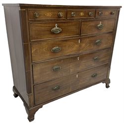 Early 19th century mahogany chest, three shallow frieze drawers over two short and three long cock-beaded drawers, canted corners with reeded moulded square columns, on ogee bracket feet
