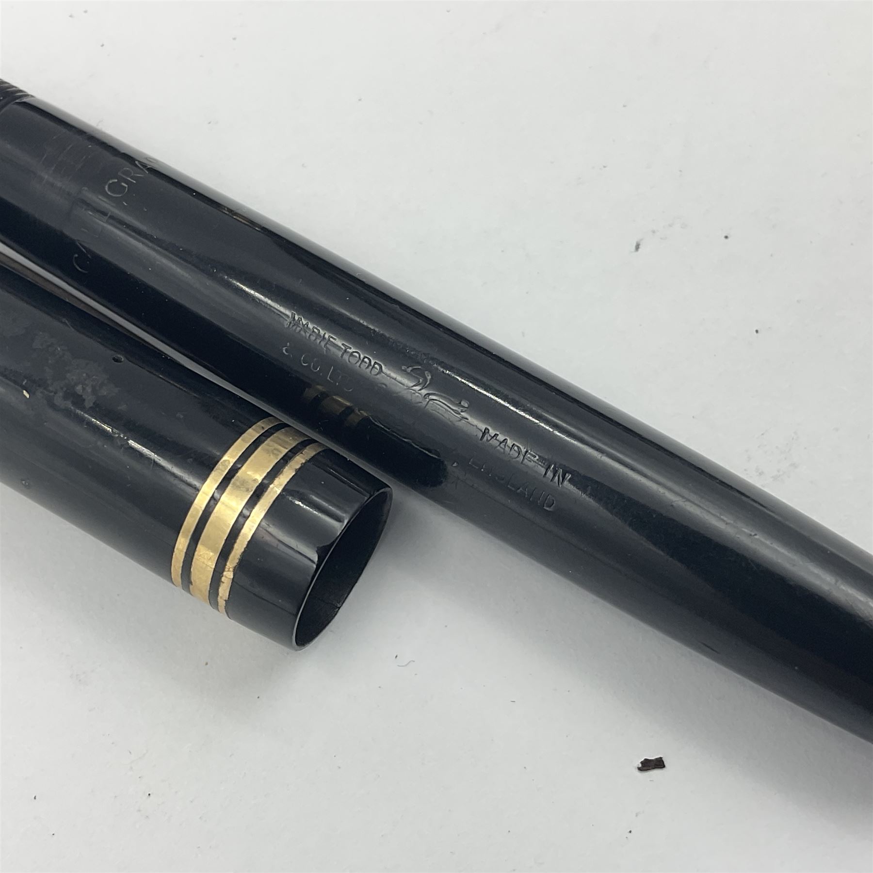 Three Swan Mabie Todd fountain pens, comprising Self Filler 3162 with black barrel and cap with single band and gold nib stamped Eternal 1 14ct, together with two Calligraph examples with gold nibs stamped 14ct, one with box, largest L12.5cm