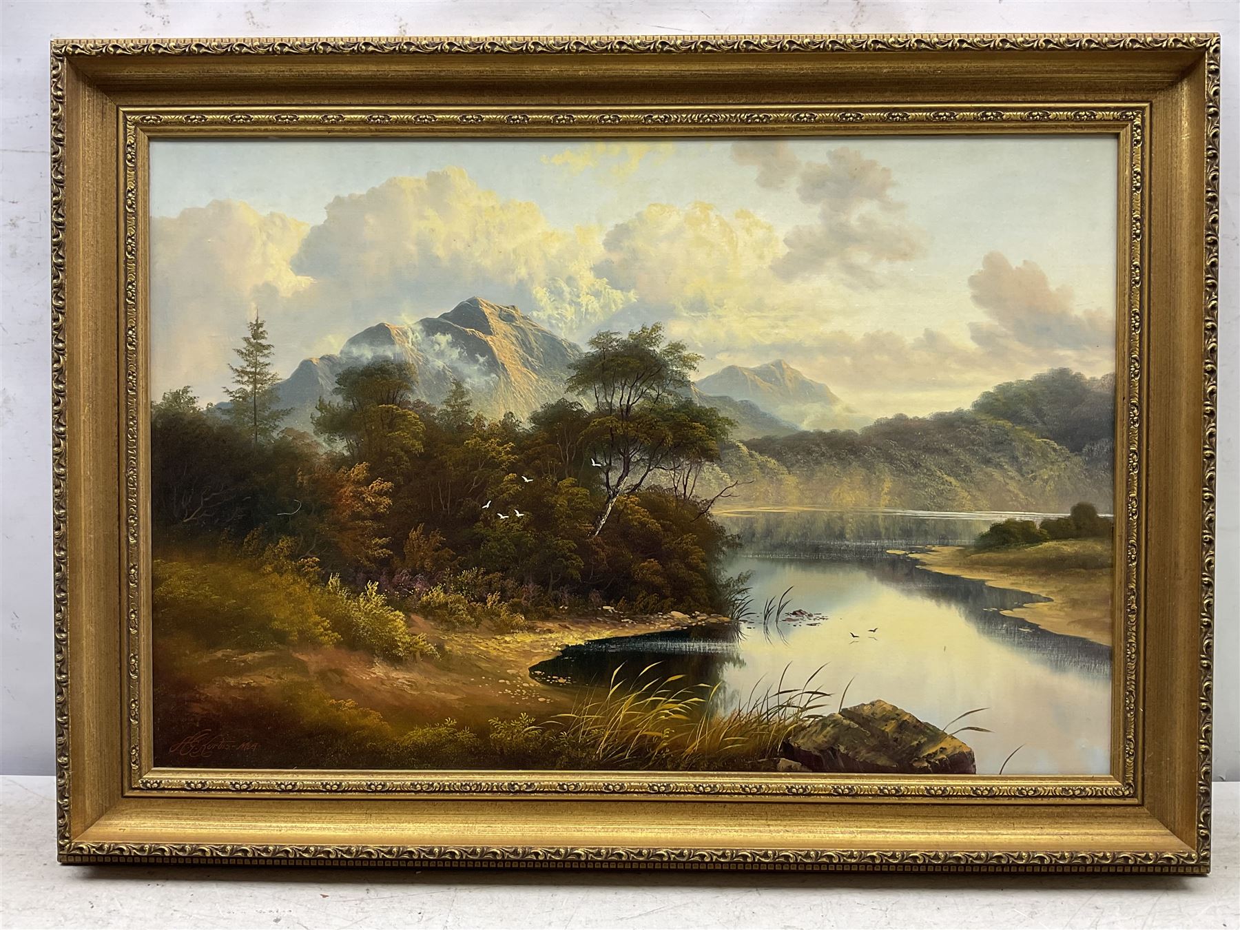 Andrew Grant Kurtis (British 1963-): Lakeside and Mountains, oil on canvas signed 49cm x 74cm; A Busch (British 20th Century): Cumbria, oil on canvas signed 49cm x 59cm (2)