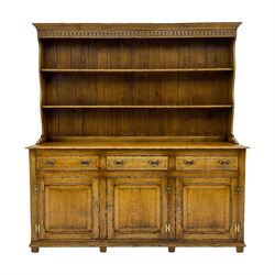 Traditional Georgian style distressed light oak dresser, fitted with three drawers and three cupboards, two tier plate rack