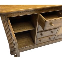 Ercol - mid-20th century dark elm 'Old Colonial' dresser, two tier plate rack with fluted uprights, base fitted with four drawers flanked by two panelled cupboards