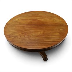 William IV mahogany circular breakfast table, banded frieze over a turned decagon pedestal with lappet carved collar, terminating to a triform platform base with scroll feet and castors