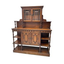 Collinson & Lock London - late 19th century walnut side cabinet, central upper display cabinet enclosed by two astragal glazed doors, ring turned supports, rectangular moulded top with dentil frieze over cupboard enclosed by geometric panelled doors and open shelves, plinth base, the cupboard door stamped 