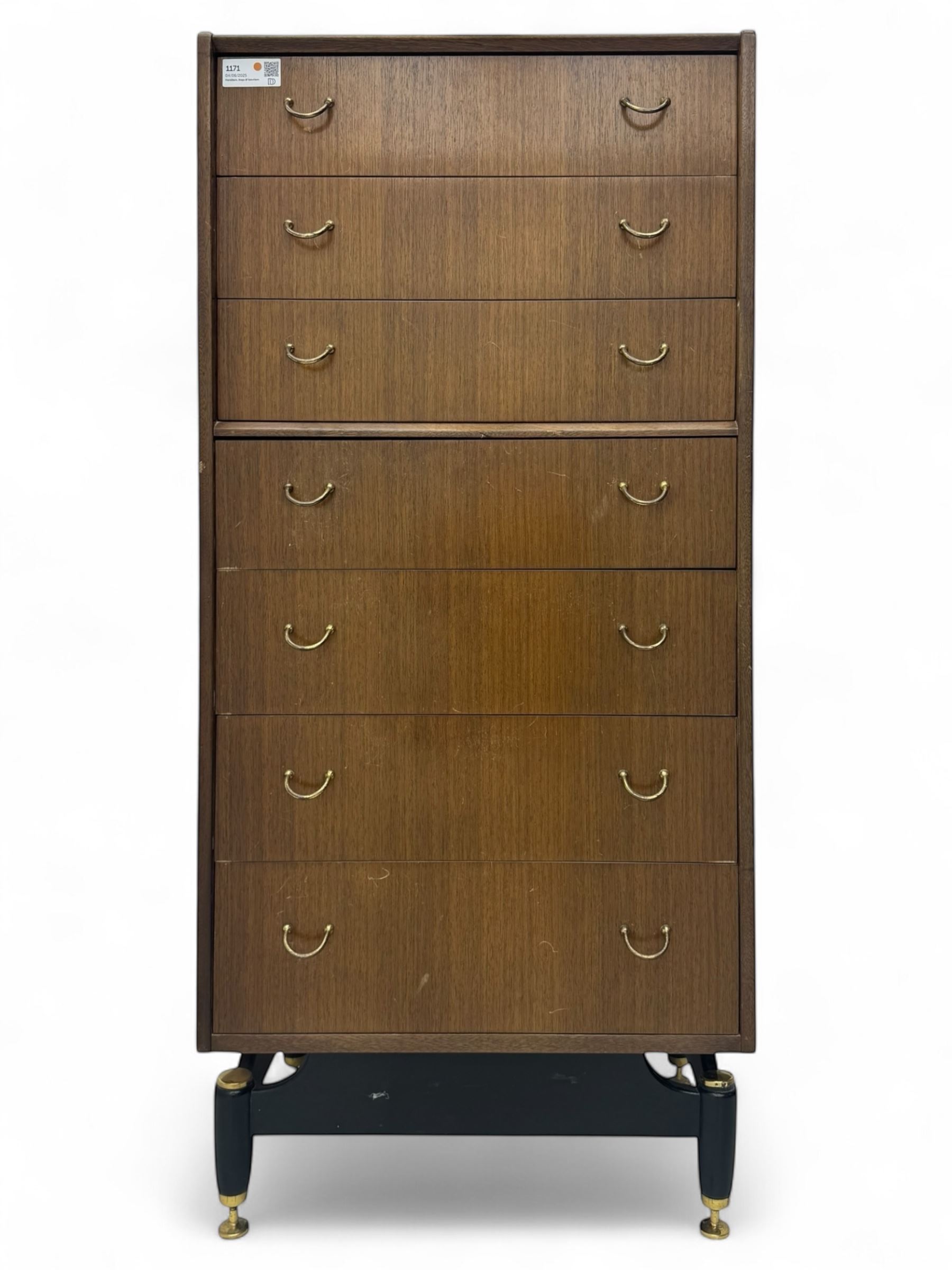G-Plan teak tallboy, seven drawer chest with brass loop handles, ebonise base with adjustable brass terminals