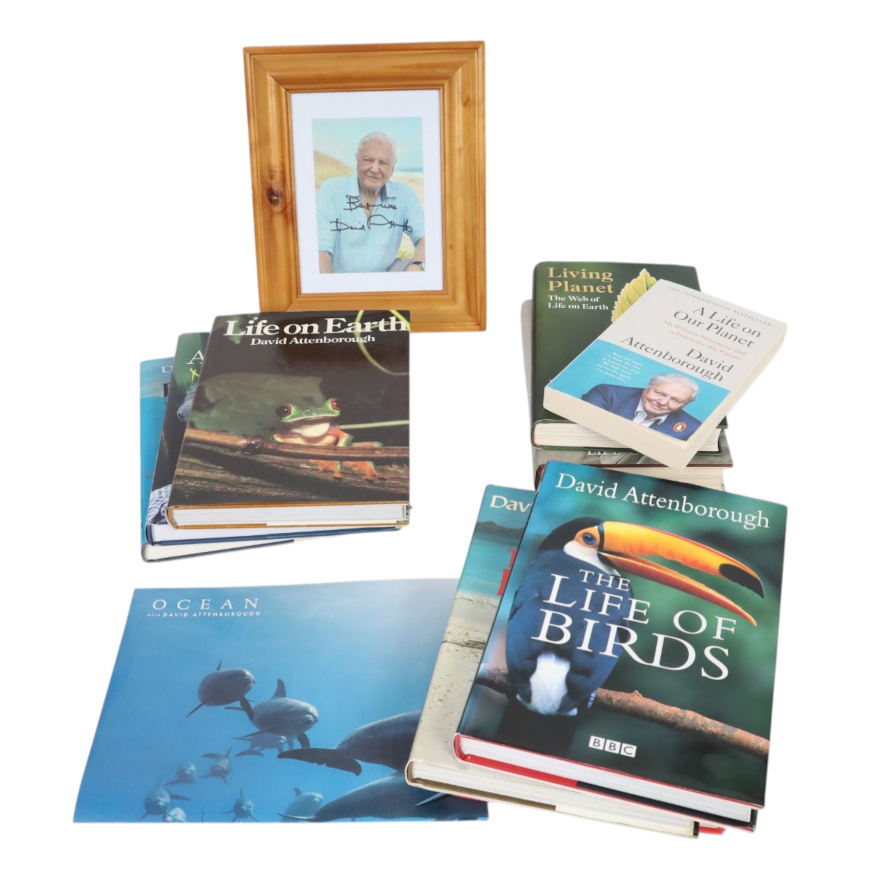 Sir David Attenborough signed colour photograph, together with nine first editions of his books, titles including Life of Earth, New Life Stories, The First Eden, A Life on Our Planet, The Trials of Life, The Living Planet, The Life of Birds, Living Planet and Life on Air