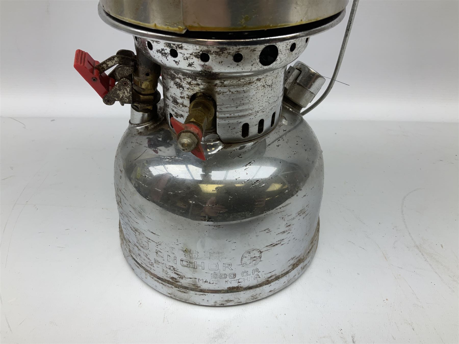 Copper and brass ship’s lamp marked ‘Anchor’, H25cm, Feuer hand storm lantern, Bialaddin Model 315 paraffin lamp and an Anchor lamp (4)