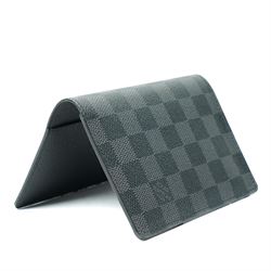 Louis Vuitton Damier Graphite canvas passport holder, the black and grey checkerboard exterior opening to a crossgrain leather interior with card slots and slip pockets, stamped Louis Vuitton Paris and made in Spain, together with original Louis Vuitton box and dust cloth