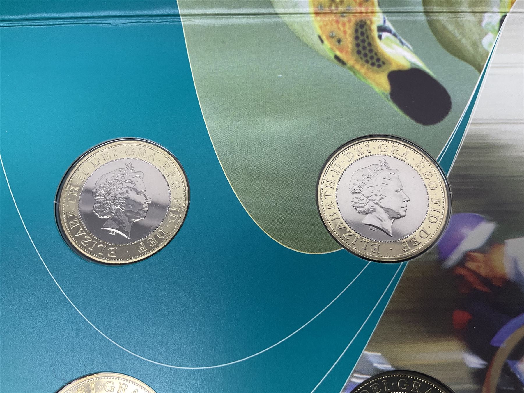 The Royal Mint Queen Elizabeth II 2002 Manchester Commonwealth Games four coin two pound coin  set in card display