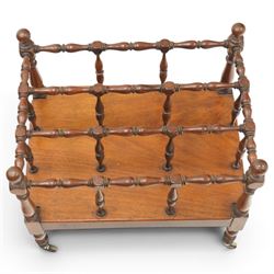 Victorian mahogany canterbury, four division top with bobbin turned rails and spindle uprights, rectangular base with moulded edge, on turned corner supports with brass castors