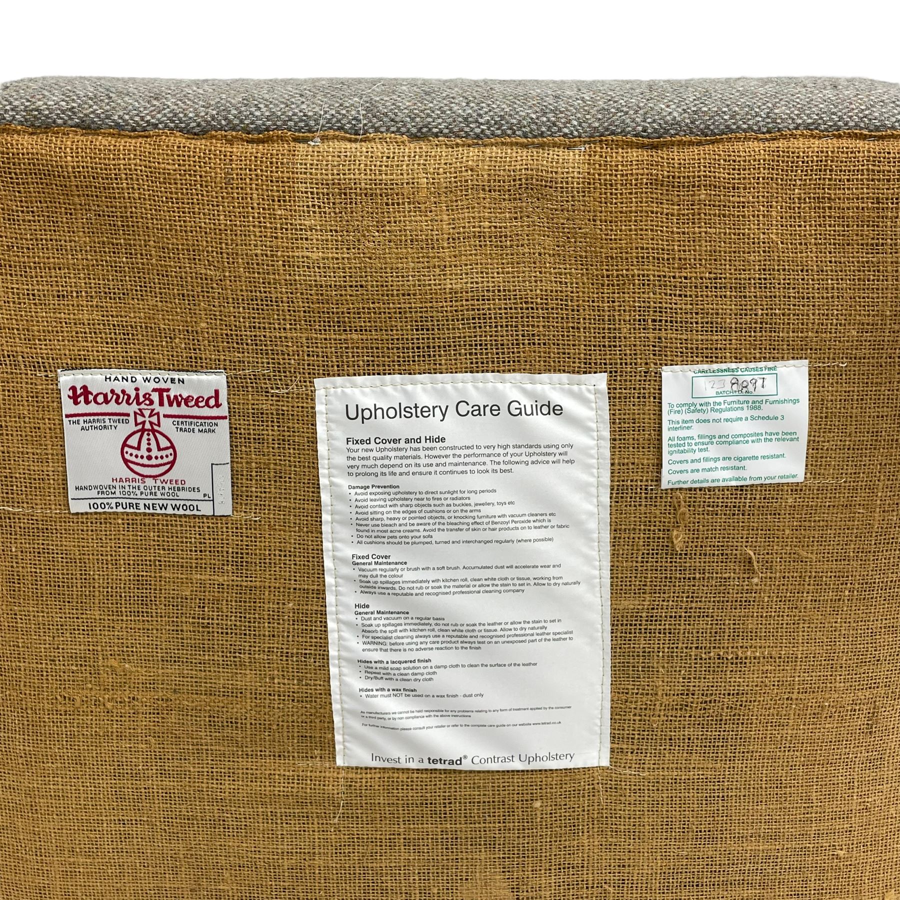 Interiors at Nine to Eleven - Edwardian design armchair, traditional shape with rolled arms, upholstered in 'Harris Tweed' fabric with leather piping, raised on square taping supports with castors