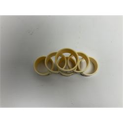 Set of six early 20th century Chinese ivory napkin rings decorated with figural scenes and calligraphy
