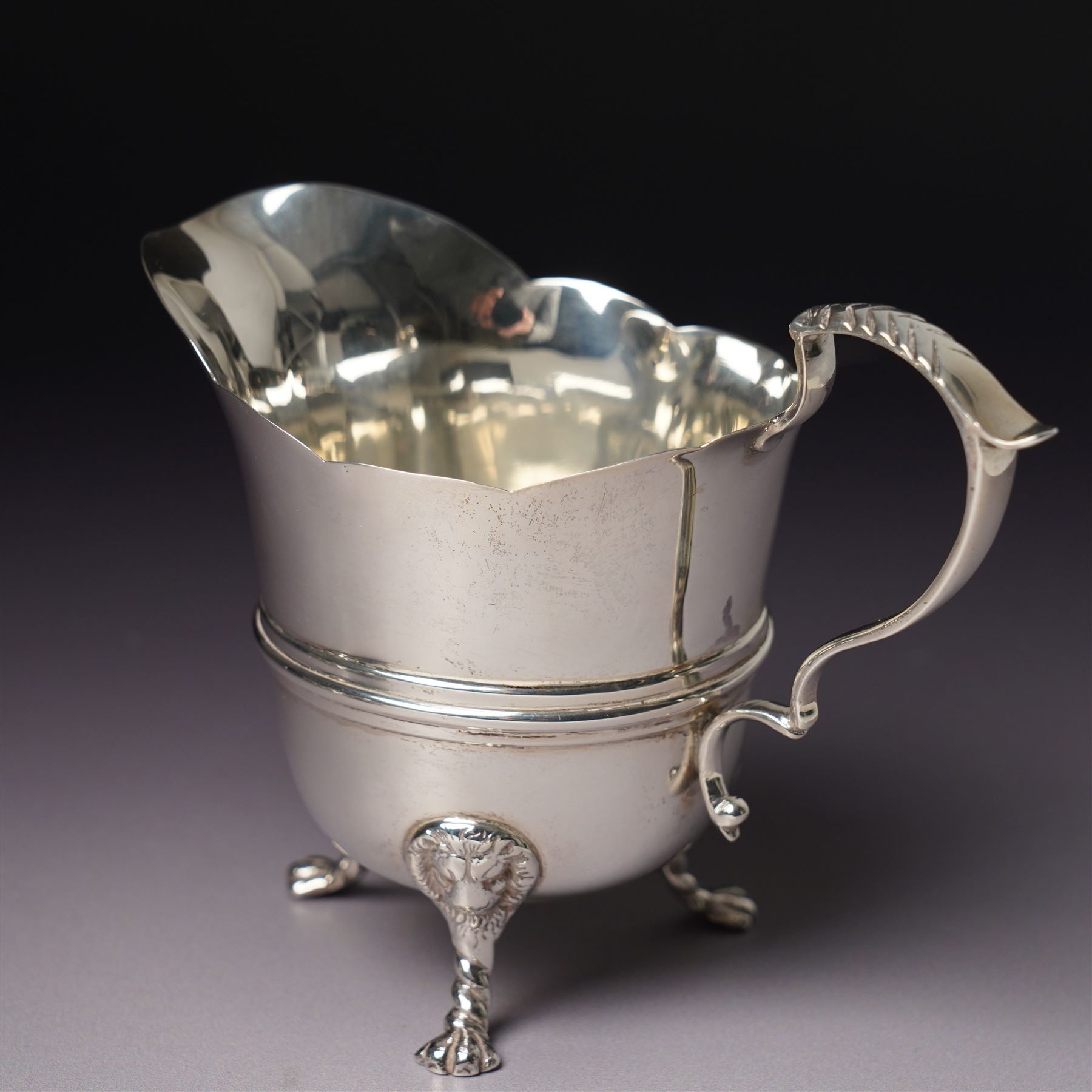 Georgian design silver cream jug Birmingham 1901 Maker George Unite, three piece silver condiment set Birmingham 1940, pair of small silver dressing table candlesticks and three condiment spoons