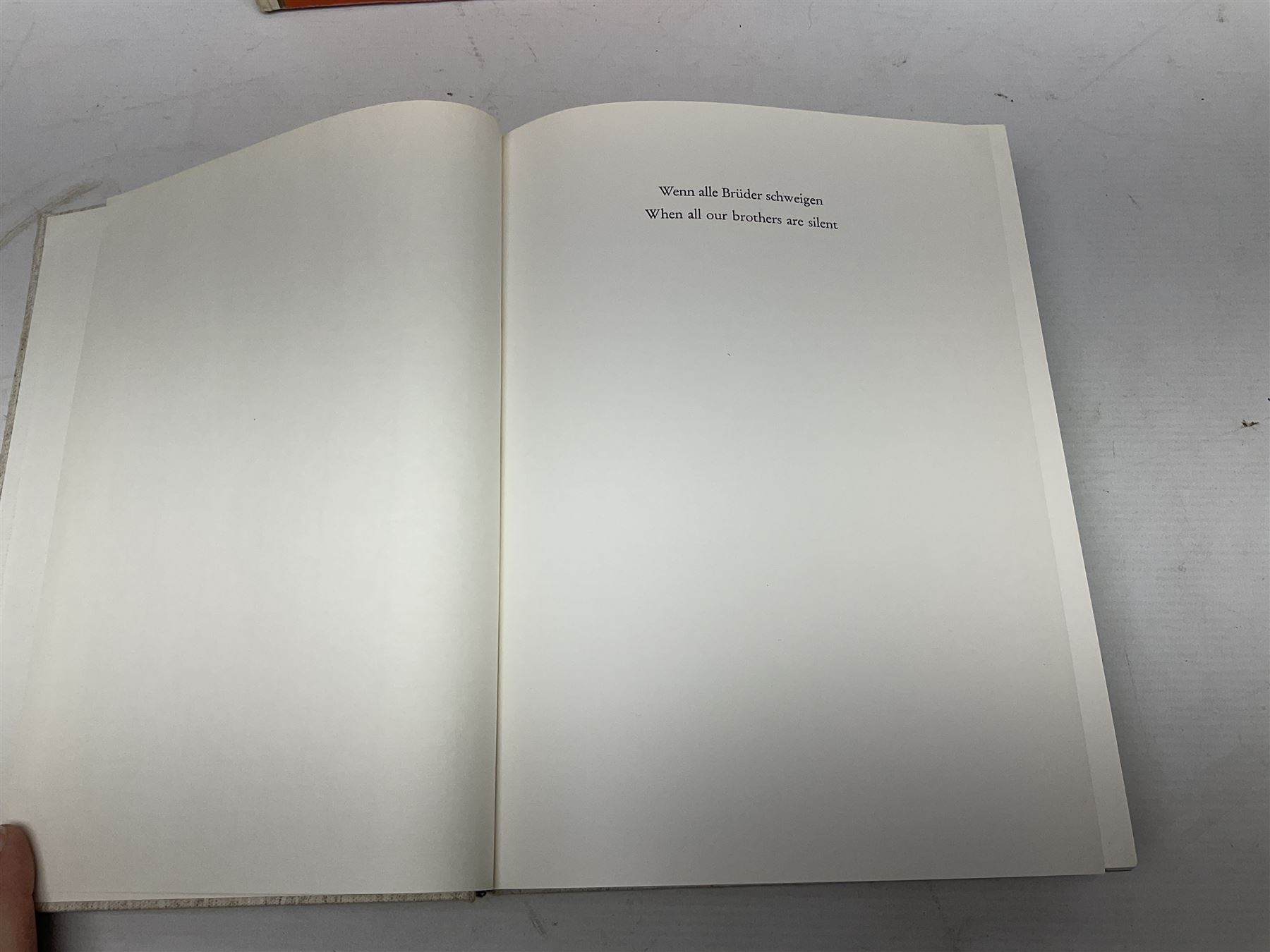 Adolf Hitler, Bilder aus dem Leben des Fuhrers [Pictures from the Life of the Fuhrer], Herausgegeben vom Cigaretten / Bilderdienst, Hamburg / Bahrenfeld, 1936, an album of two hundred tipped-in cards bearing photographs by Heinrich Hoffman, originally collected with cigarettes, 31 cm x 24 cm; together with a Waffen-SS book 'Wenn alle Bruder schweigen'; Hamburg 1939-1945; and two other booklets