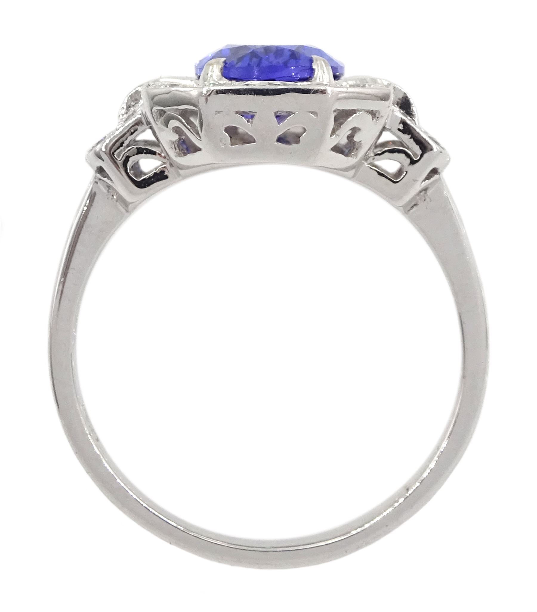 18ct gold oval tanzanite, round and baguette cut diamond cluster ring, stamped 750, tanzanite approx 1.85 carat, total diamond weight approx 0.70 carat