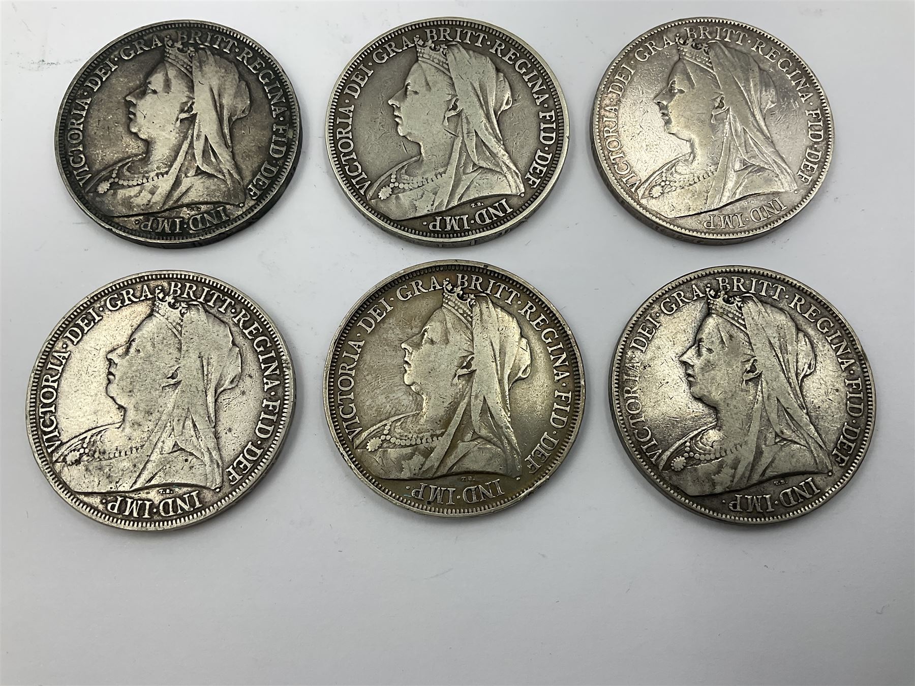 Six Queen Victoria silver crown coins, dated 1893, two 1896, 1898, 1899 and 1900