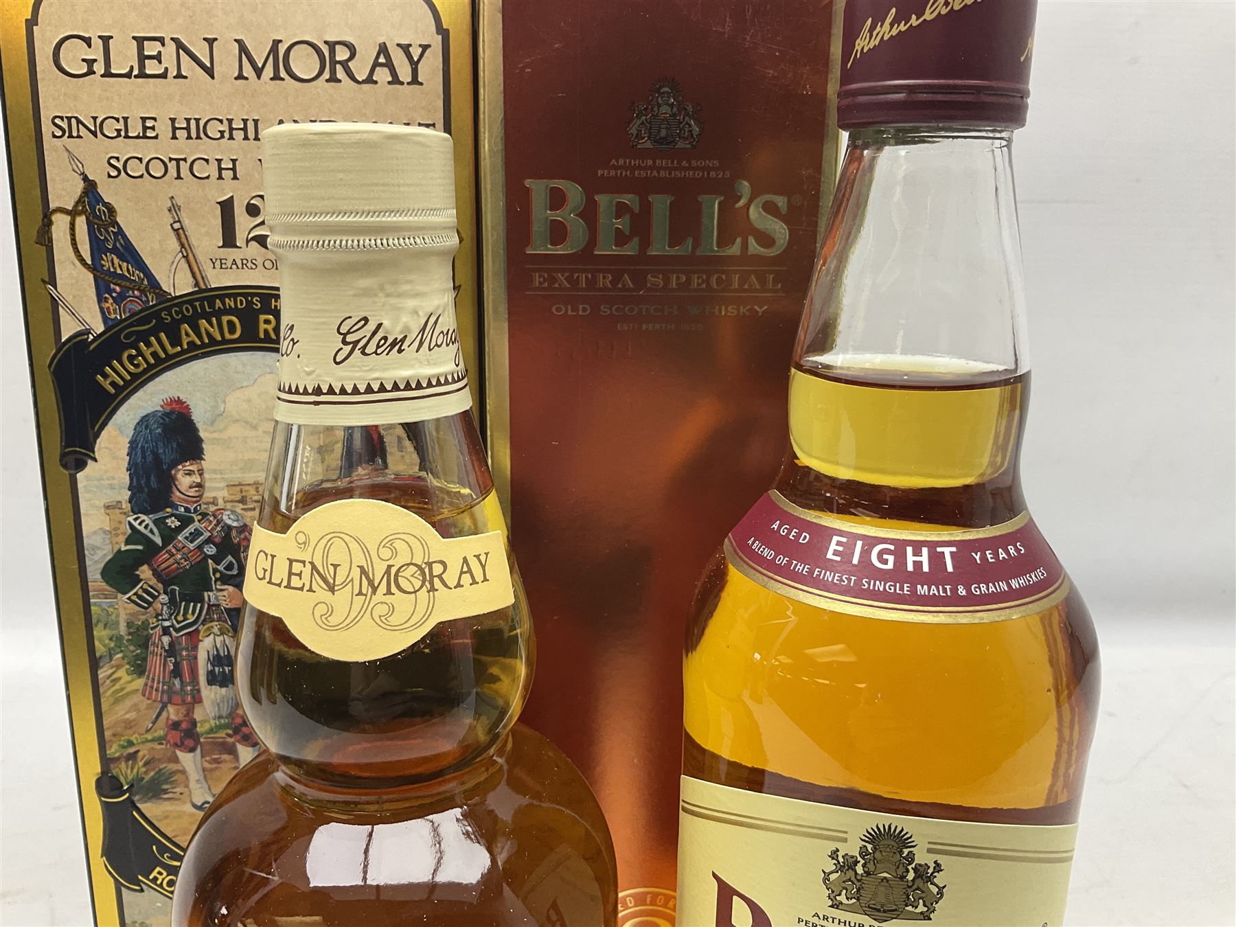 Glen Moray 12 Year Single Malt Highland Scotch Whisky, 70cl 40% vol, one bottle, in Highland Regiments The Black Watch presentation tin, Glenfiddich Pure Malt Scotch Whisky, Special Old Reserve, 70cl 40% vol, one bottle, in Clan Murray presentation tin, Bell's Extra Special Old Scotch Whisky, Aged 8 Years, 70cl 40% vol, one bottle, in box and Bell's Extra Special Old Scotch Whisky, 1l, 43% vol (4)