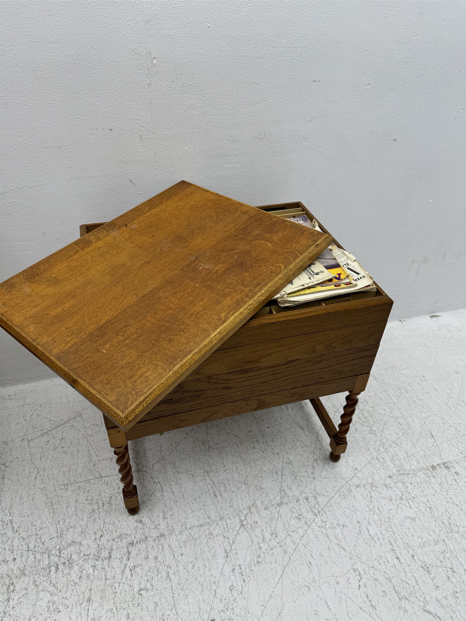 Large collection of Meccano, including perforated strips, wheels, cogs, nuts and bolts, various Meccano instruction manuals and magazines, all housed within a modified wooden box, with three tiered compartmentalised sections and upon four twist legs, box H60cm