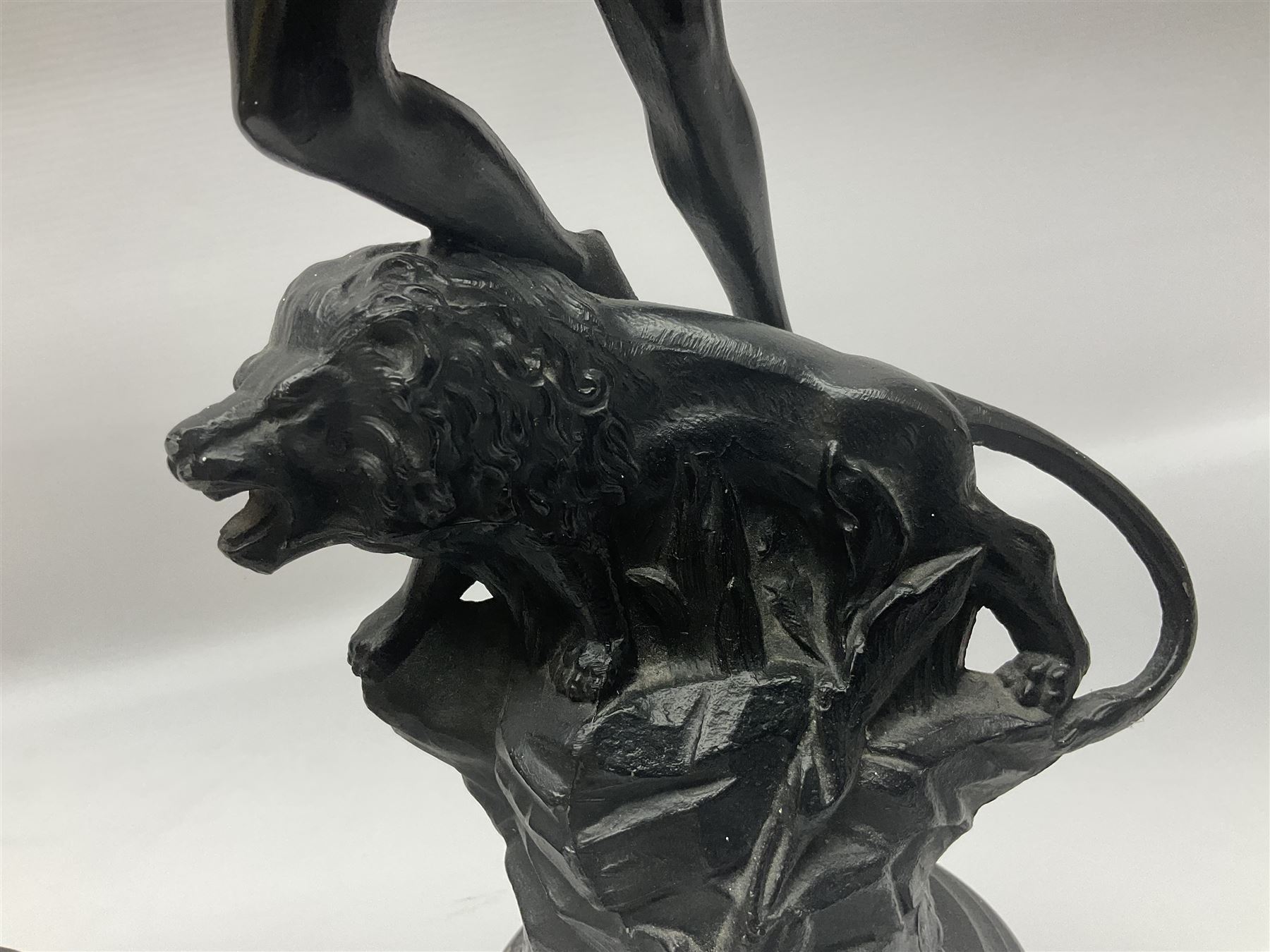 Pair of spelter figures, Le Force and Le Pouvoir, modeled as figures standing on lions, arms held aloft, H51cm 