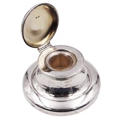 1920's silver mounted capstan inkwell, of typical plain form, the hinged cover lifting to reveal a gilt interior and removable clear glass inkwell, hallmarked Mappin & Webb Ltd, Birmingham 1928, H5cm base D10cm