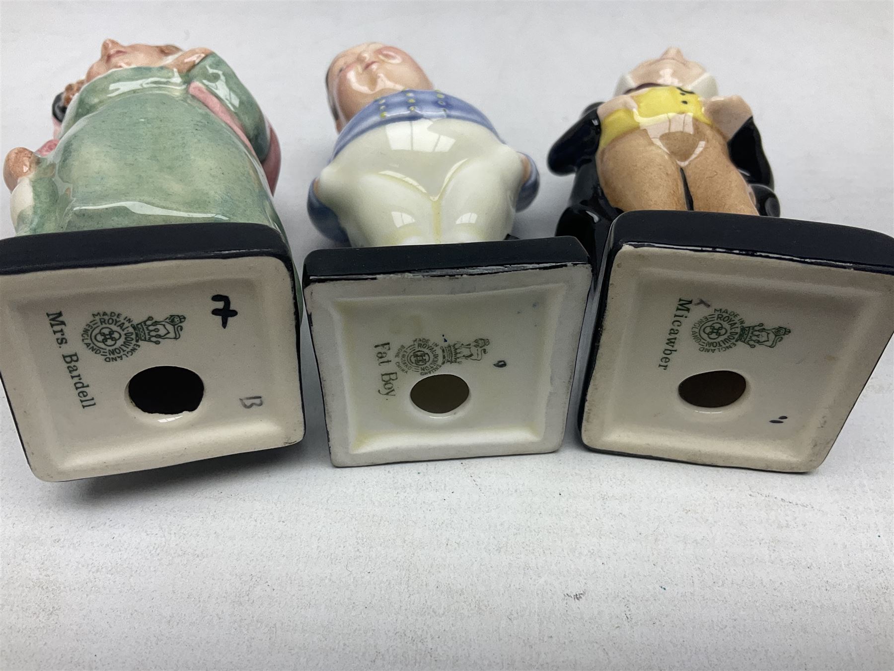 Sixteen Royal Doulton Charles Dickens figures, to include Oliver Twist, Fat Boy, Fagan, Stiggins etc, all with printed marks beneath