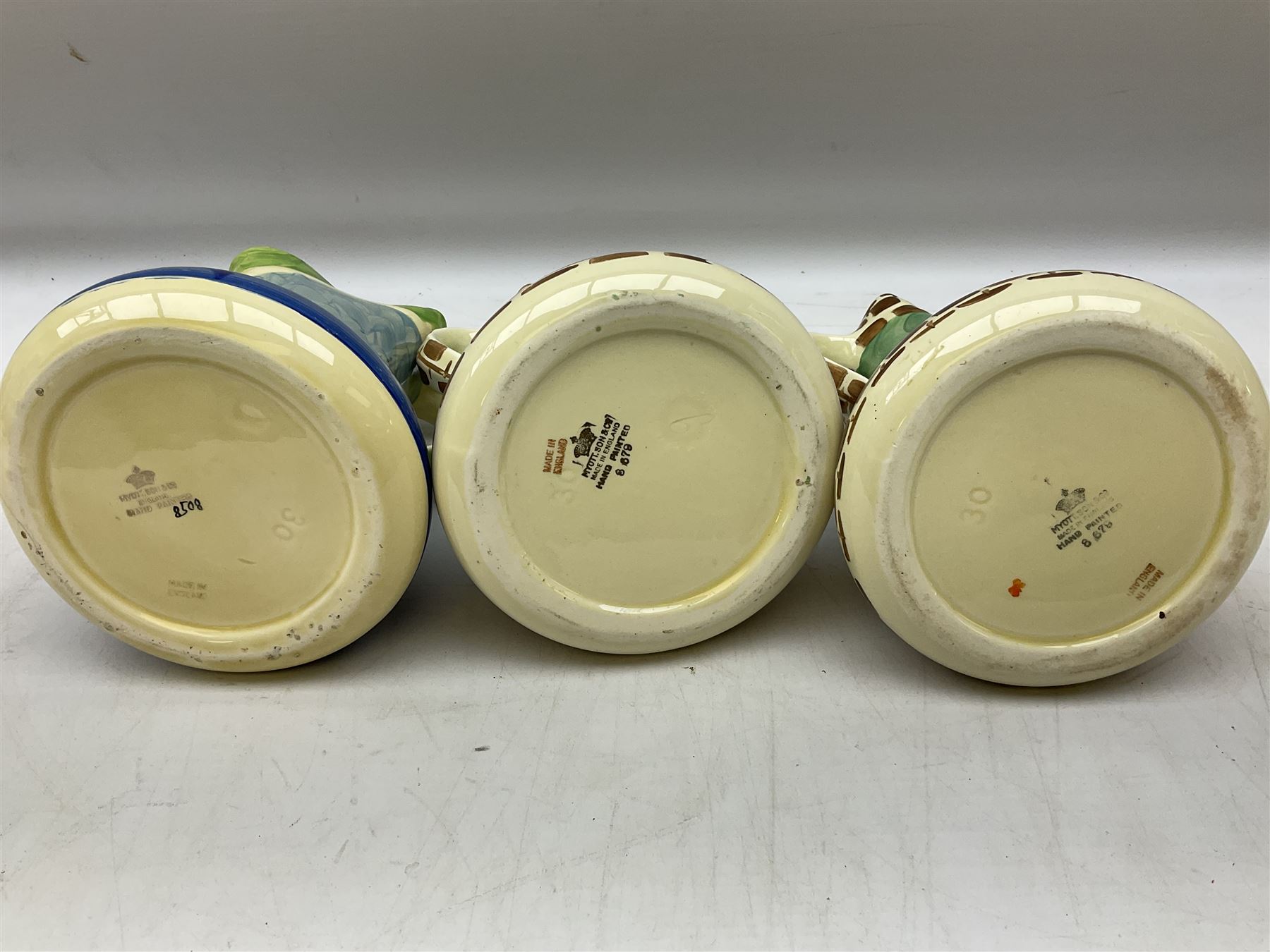 Seven Myott Son & Co hand painted jugs, all with printed mark beneath, H21cm