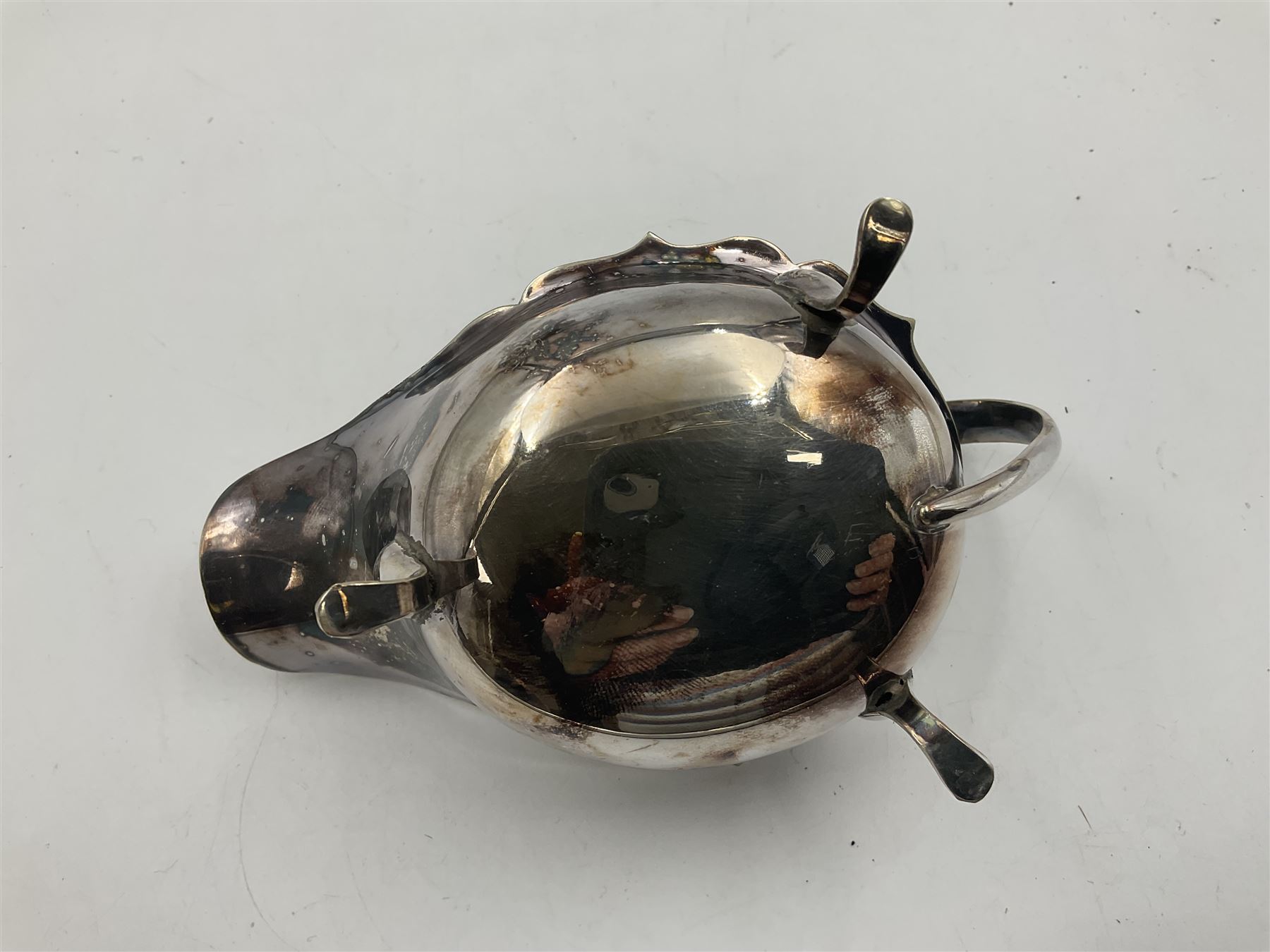 Silver plated seven bar toast rack by Mappin & Webb, together with other silver plated items including pair of bottle coasters, swing handled baskets and two sauce boats
