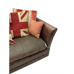 Large Knole design three-seat sofa upholstered in brown leather with scatter cushions upholstered in contrasting striped and Union Jack patterned fabric, on block feet (W210cm, H100cm, D102cm); together with matching rectangular footstool (135cm x 75cm, H45cm)