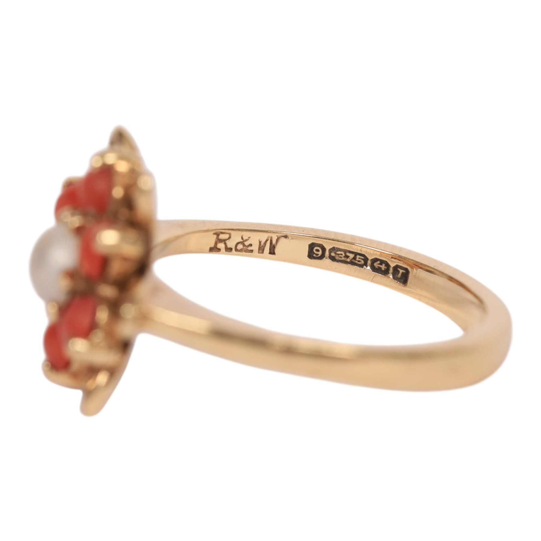 Gold coral and pearl ring and a gold three stone garnet ring, both hallmarked 9ct