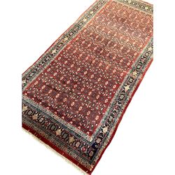 North West Persian Bidjar carpet, the field decorated with repeating Herati motifs, the border decorated with plant motifs 